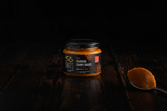 Frankie's Signature Curry Sauce with spoon